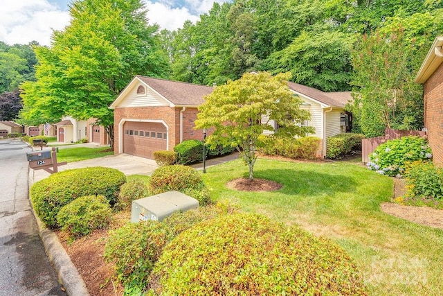 view of front of house featuring a front yard and a garage