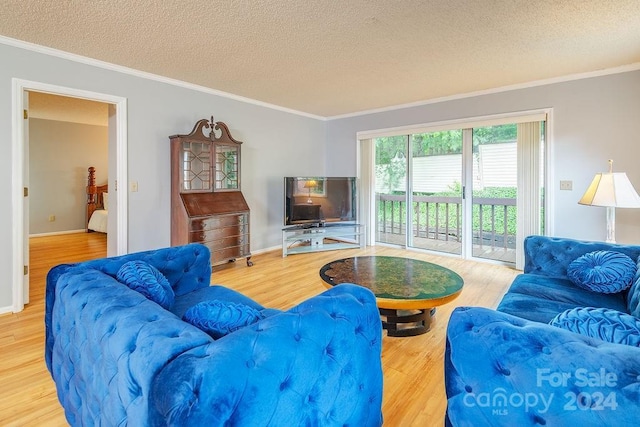 living room with crown molding, a textured ceiling, and hardwood / wood-style flooring