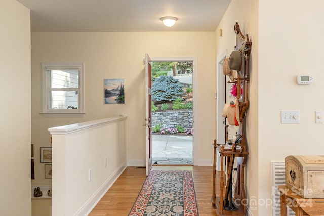 foyer entrance with light hardwood / wood-style flooring