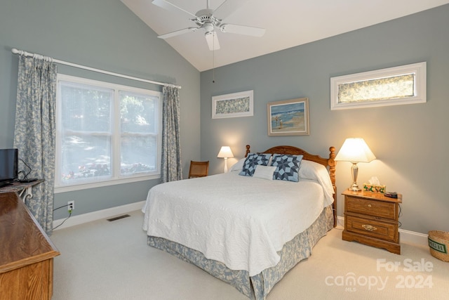 carpeted bedroom with vaulted ceiling and ceiling fan