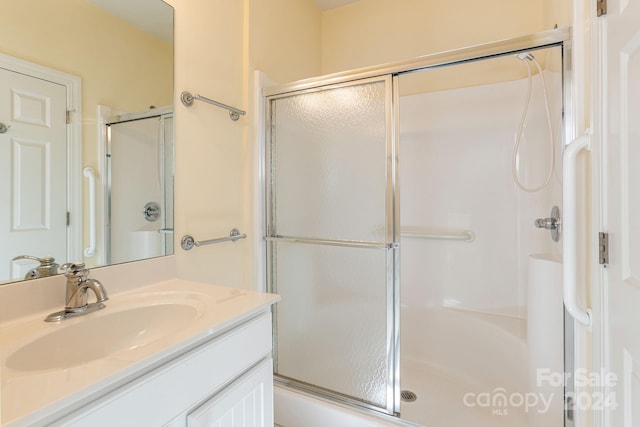 bathroom featuring vanity and walk in shower