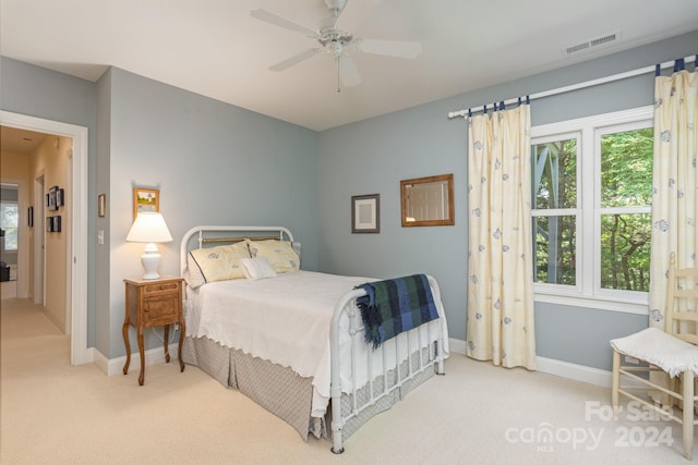 carpeted bedroom featuring ceiling fan