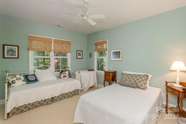 carpeted bedroom featuring ceiling fan