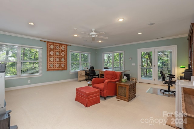 office space featuring ceiling fan, light colored carpet, and ornamental molding