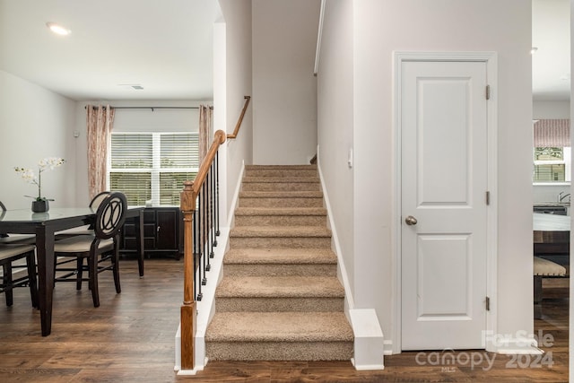 staircase featuring hardwood / wood-style flooring