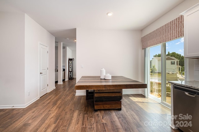 dining area featuring dark wood-type flooring