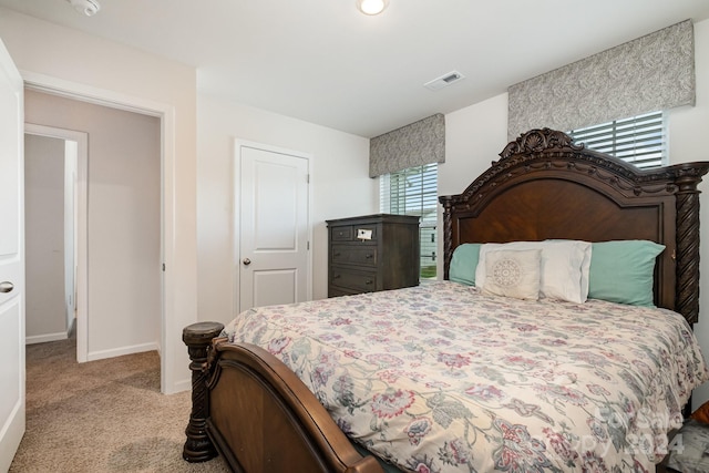 bedroom with light colored carpet