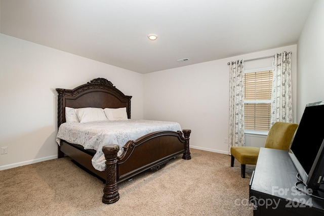 bedroom with light carpet