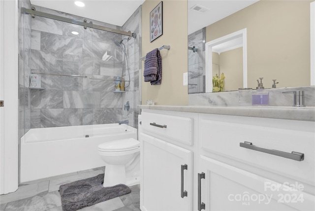 full bathroom featuring toilet, tiled shower / bath, and vanity