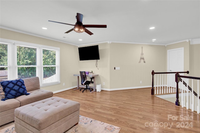 living room with ceiling fan, crown molding, and hardwood / wood-style floors