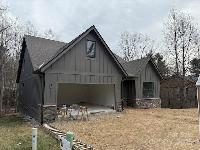 modern farmhouse style home featuring a garage