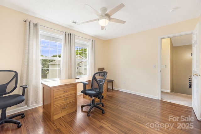 office area featuring a textured ceiling, dark hardwood / wood-style floors, and ceiling fan