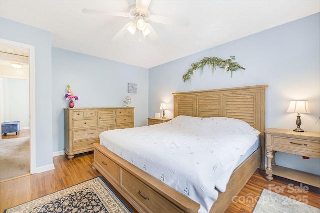 bedroom with ceiling fan and light wood-type flooring