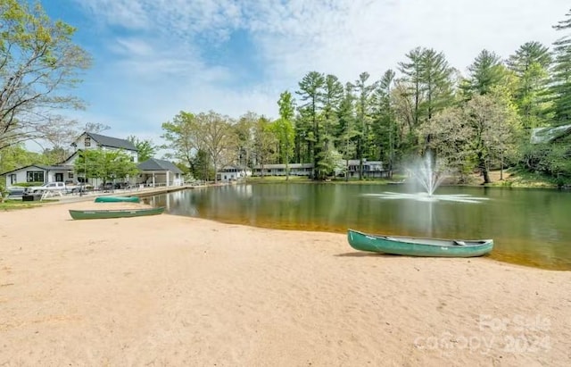 surrounding community featuring a water view