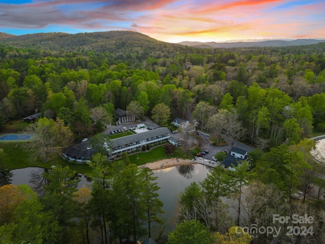 aerial view at dusk with a water and mountain view