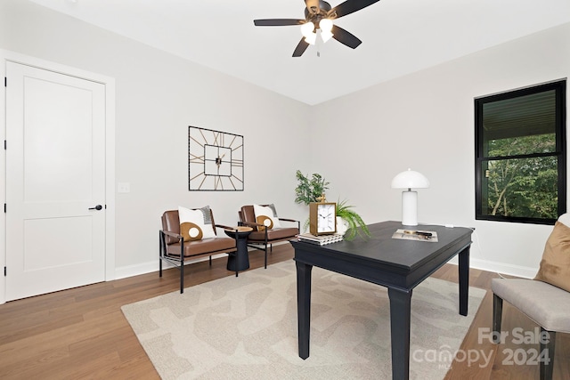 home office with ceiling fan and hardwood / wood-style flooring