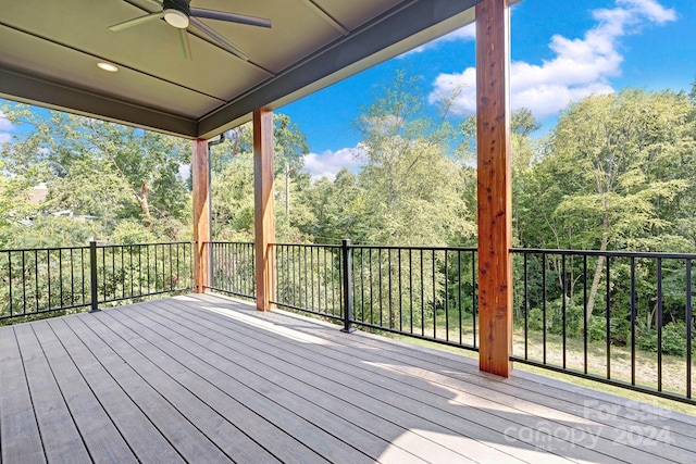 wooden deck featuring ceiling fan