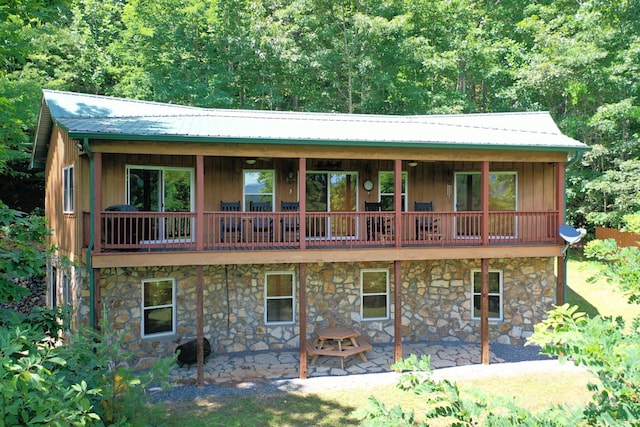 rear view of property featuring a patio