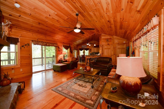 living room with wooden ceiling, wood walls, ceiling fan, hardwood / wood-style flooring, and lofted ceiling