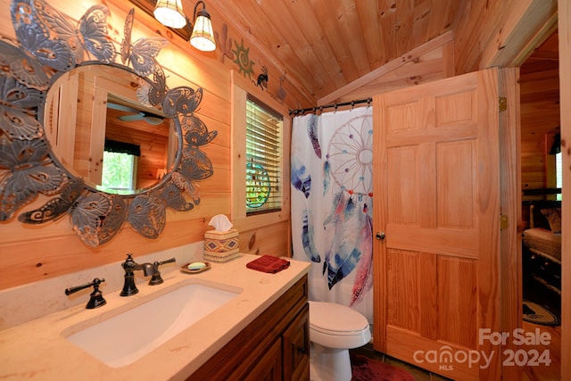 bathroom with vaulted ceiling, wooden ceiling, wood walls, toilet, and vanity