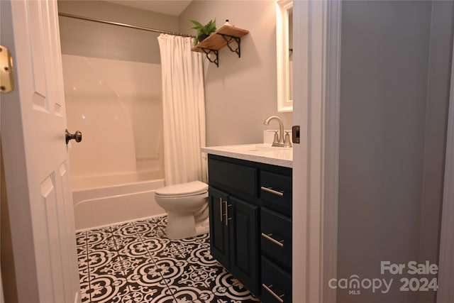 full bathroom with toilet, vanity, tile patterned flooring, and shower / bath combo