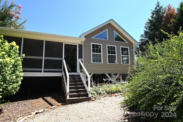 view of front of property featuring a sunroom