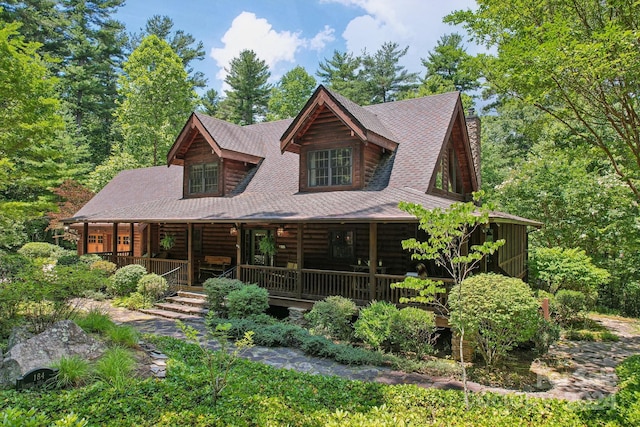 back of property with covered porch