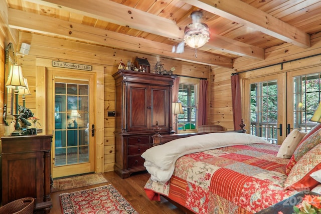 bedroom featuring wooden walls, ceiling fan, dark wood-type flooring, access to exterior, and french doors