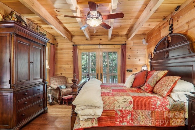 bedroom with access to exterior, beamed ceiling, wooden walls, and wooden ceiling