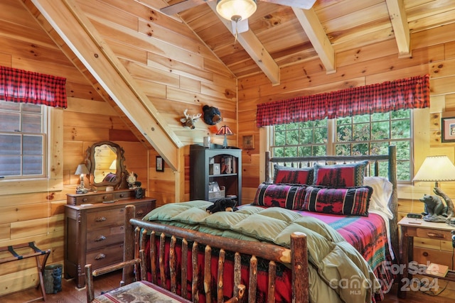 bedroom featuring wooden ceiling, vaulted ceiling with beams, and wooden walls