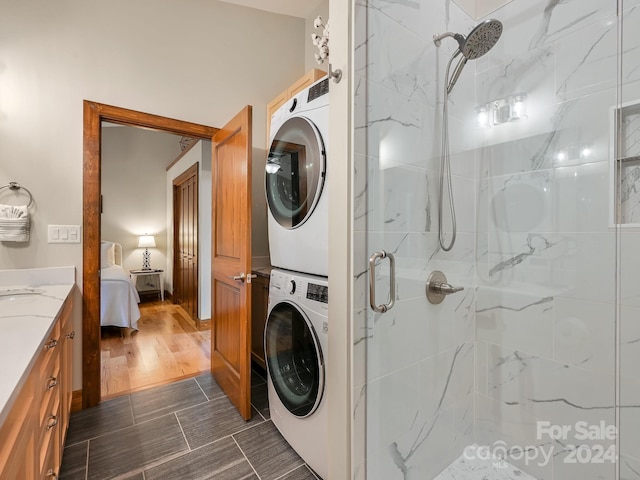 laundry area featuring stacked washer and dryer