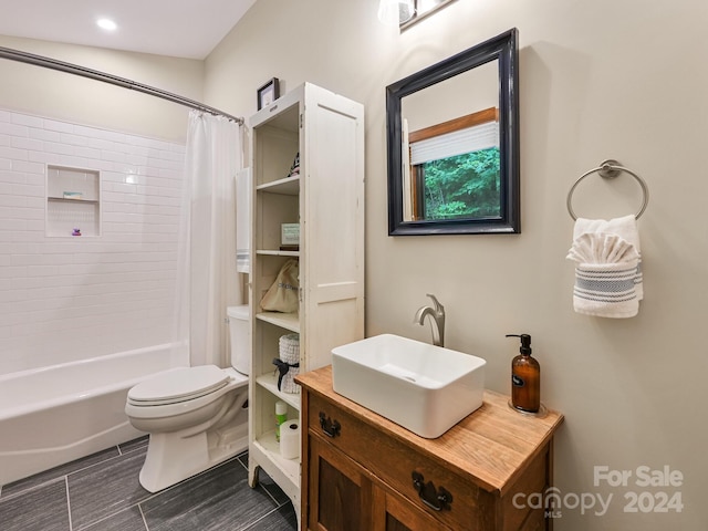 full bathroom featuring toilet, vanity, and shower / tub combo