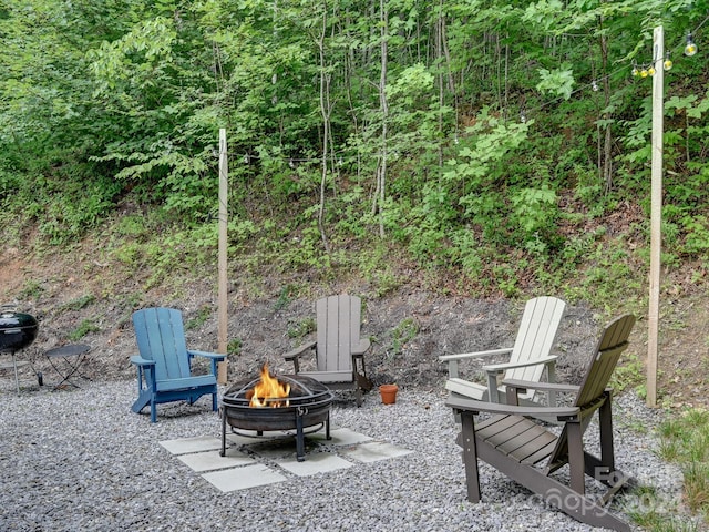 view of patio featuring an outdoor fire pit