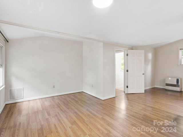 spare room featuring light hardwood / wood-style floors