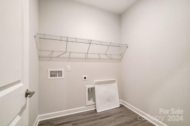 clothes washing area featuring washer hookup, electric dryer hookup, and dark hardwood / wood-style floors