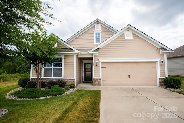 craftsman-style home with a front lawn and a garage