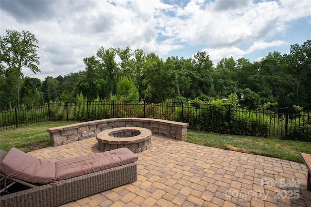 view of patio / terrace with a fire pit