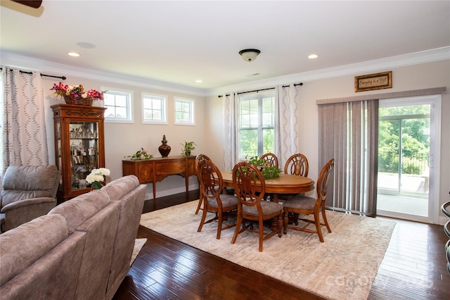 dining room featuring dark hardwood / wood-style floors and ornamental molding