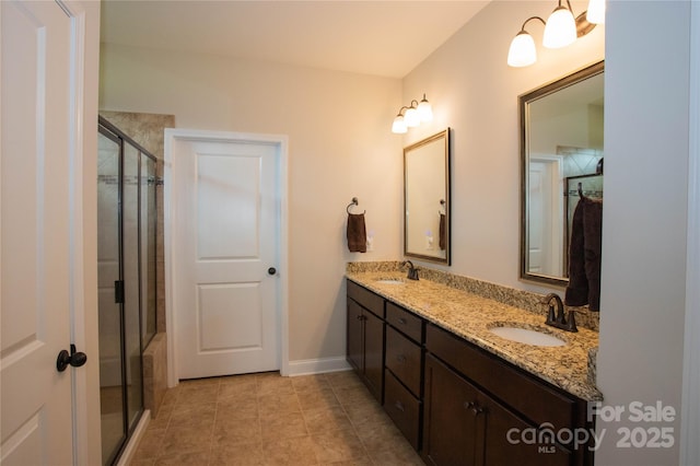 bathroom with tile patterned floors, vanity, and walk in shower