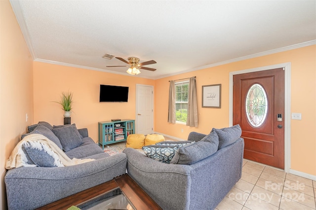 living room with light tile patterned floors, ceiling fan, and ornamental molding