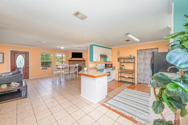 kitchen with kitchen peninsula, white electric range, light tile patterned floors, and crown molding