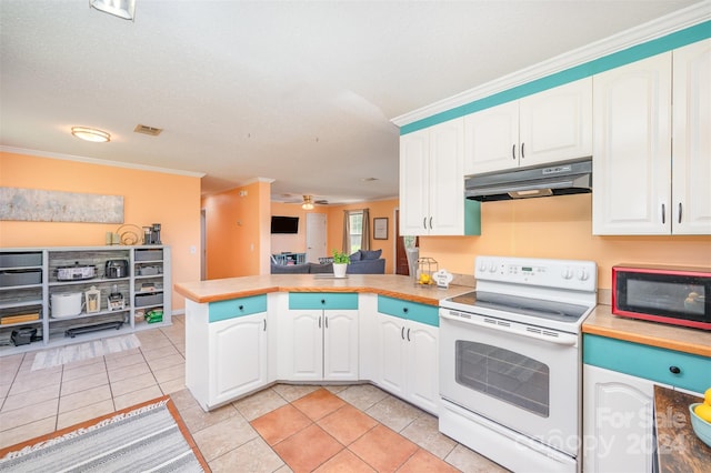 kitchen featuring kitchen peninsula, ornamental molding, light tile patterned floors, white electric stove, and white cabinetry