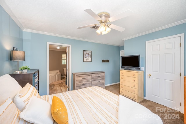 bedroom with ornamental molding, a textured ceiling, light colored carpet, ceiling fan, and connected bathroom