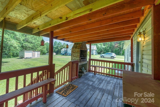 wooden deck featuring a yard