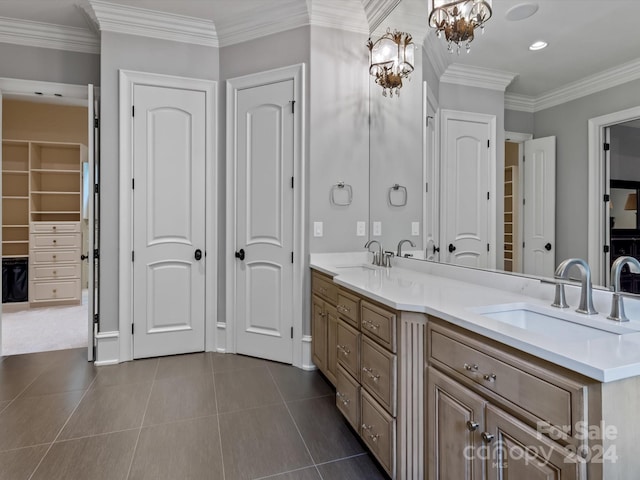 bathroom featuring ornamental molding, tile patterned flooring, a chandelier, and vanity