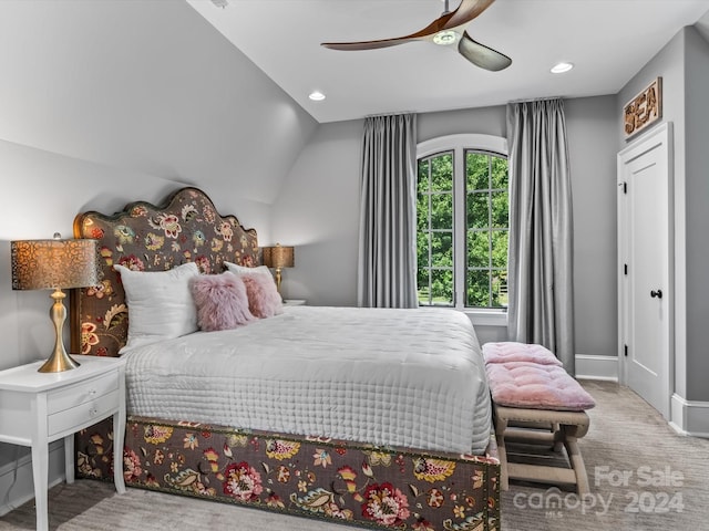 bedroom featuring ceiling fan, lofted ceiling, and carpet floors