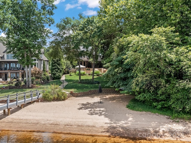 view of property's community featuring a lawn