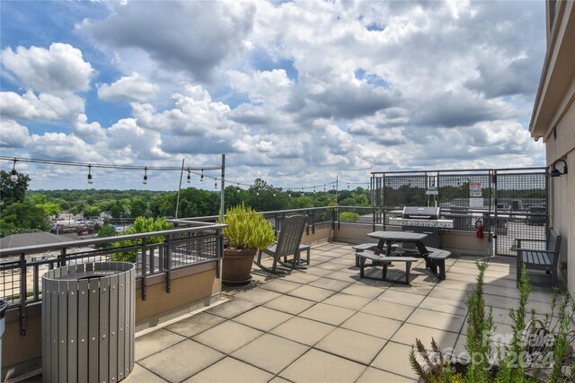 view of patio / terrace with a balcony and area for grilling