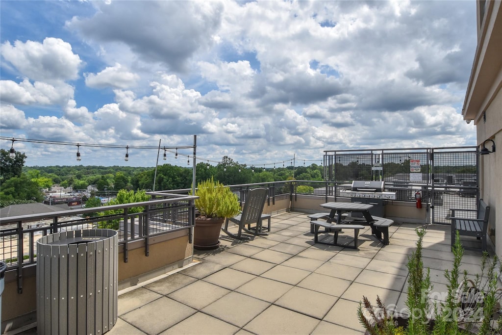 view of patio / terrace with a balcony and area for grilling