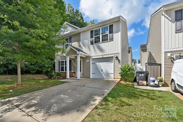 view of front of property with a garage and a front lawn